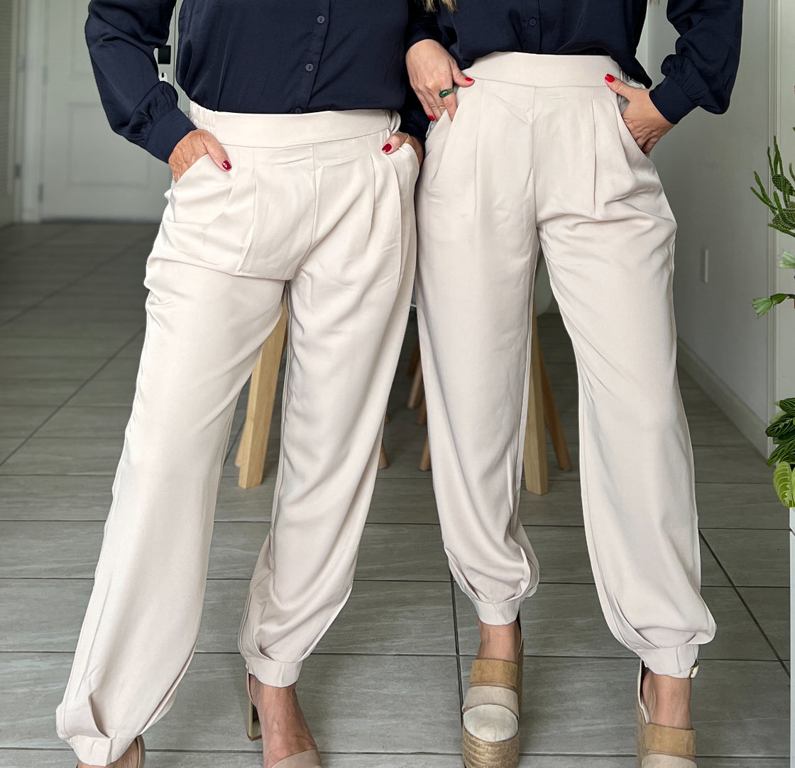 Pants. Beige trousers with ruched detail on the boot