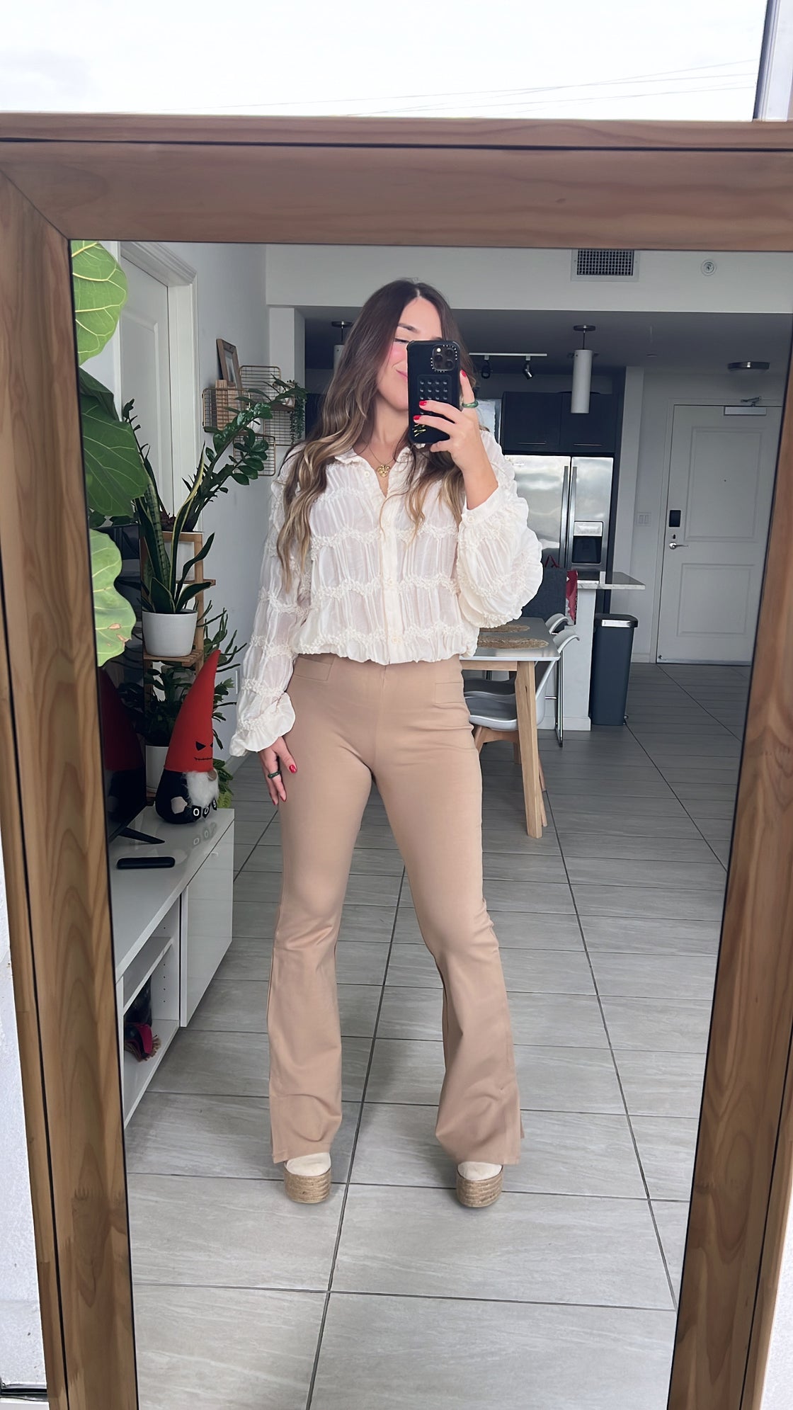 Pants. Khaki and black stretch pants with detail on the boot
