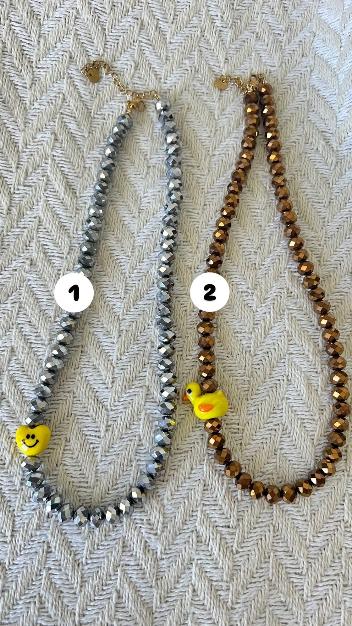 necklace. Gold or silver crystal necklace with a happy face or duck