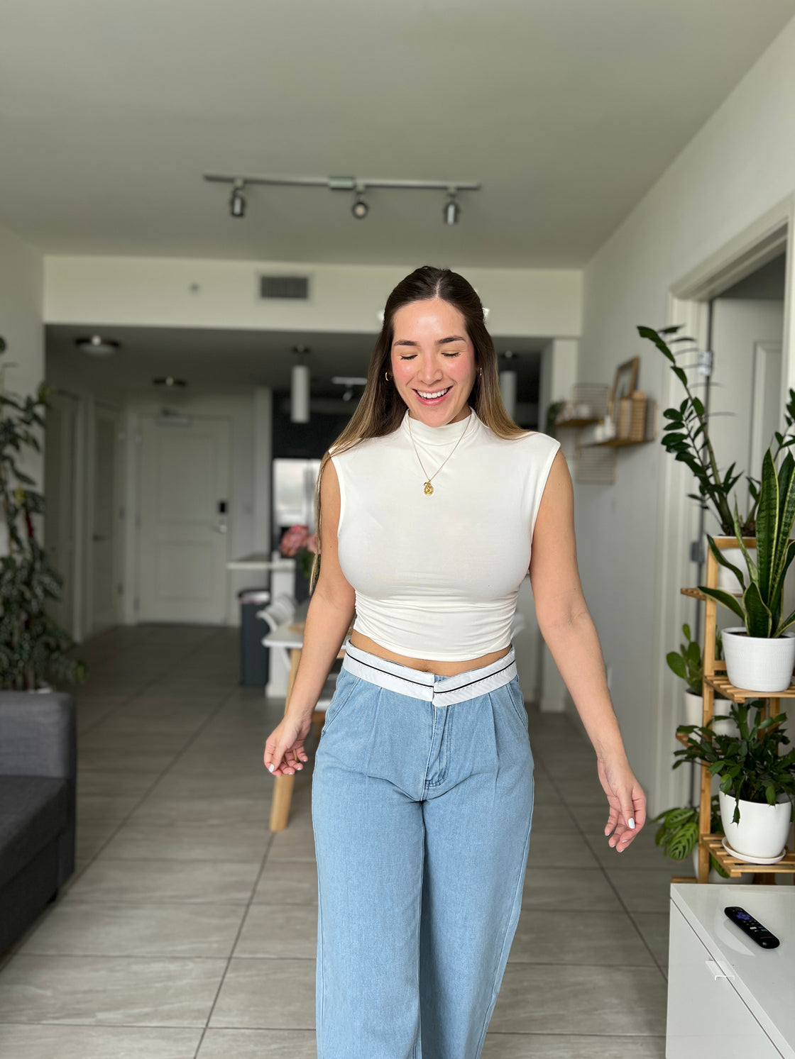 white blouse with ruffles on the sides
