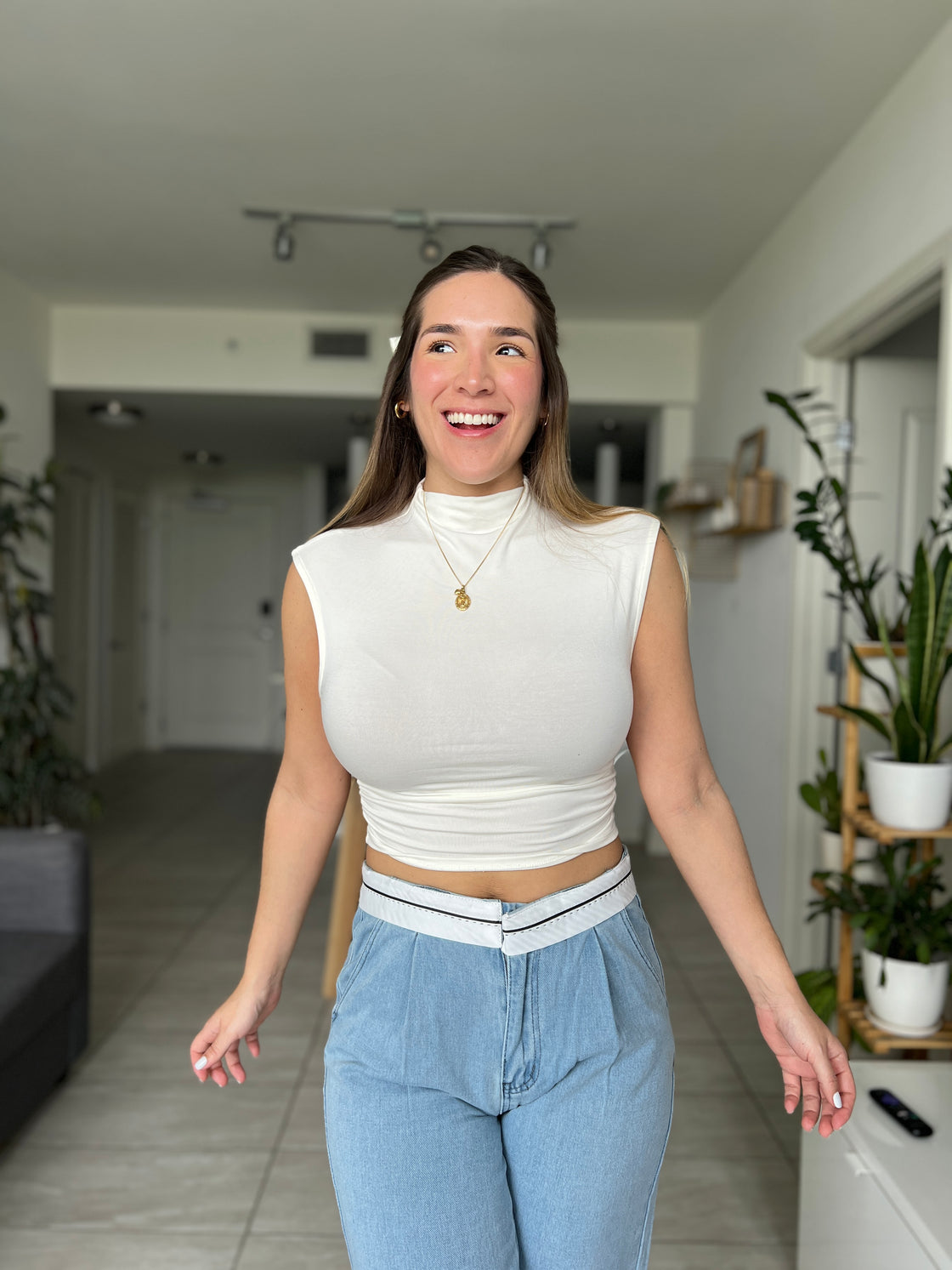 white blouse with ruffles on the sides