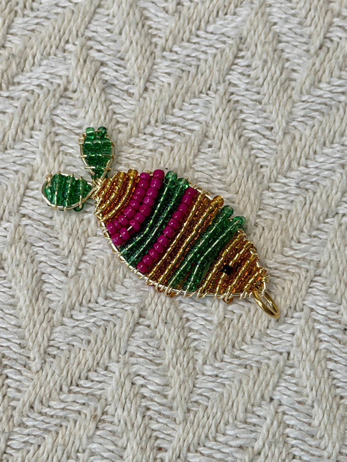 Natural stone necklace with a handmade fish-shaped pendant.