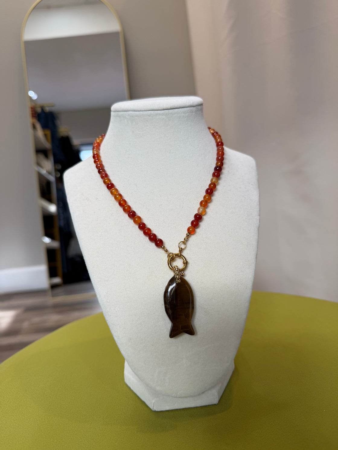 Semiprecious stone necklace with a fish-shaped pendant