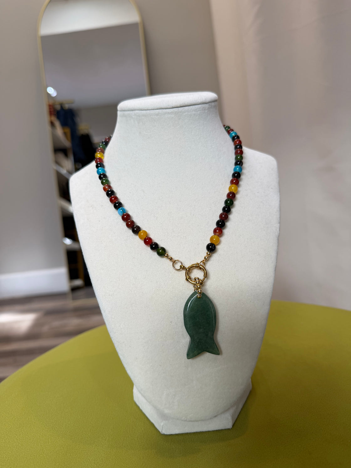 Semiprecious stone necklace with a fish-shaped pendant