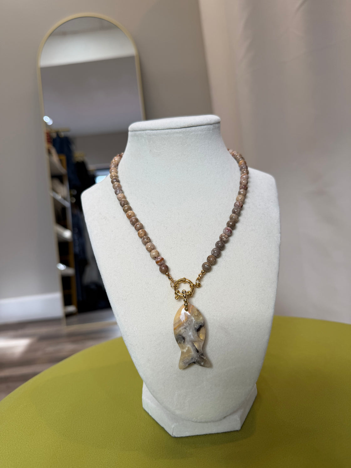 Semiprecious stone necklace with a fish-shaped pendant