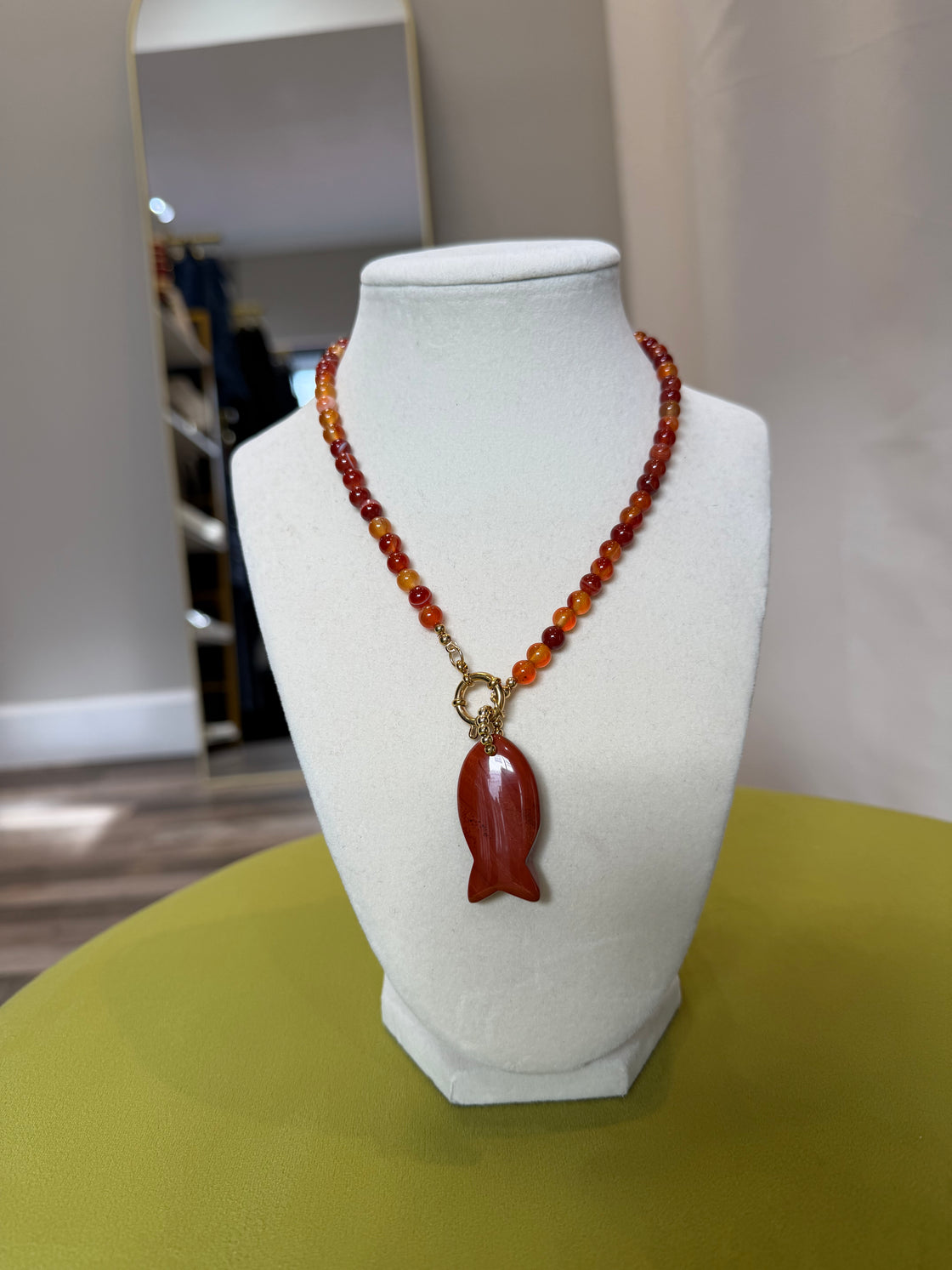 Semiprecious stone necklace with a fish-shaped pendant